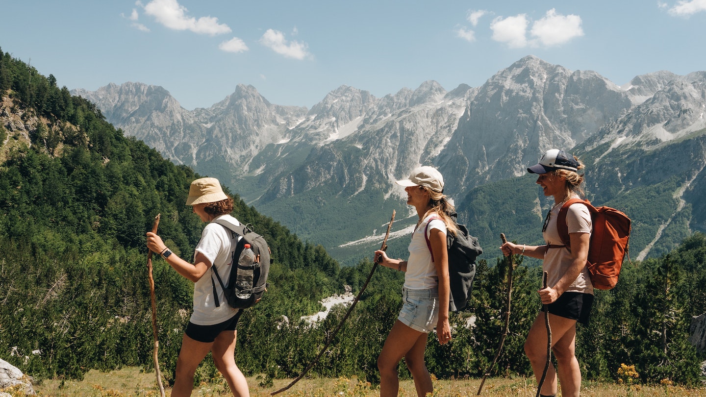 Hikers nearing the Valbona Pass in Albania's Accursed Mountains © Ilir Tsouko/Lonely Planet