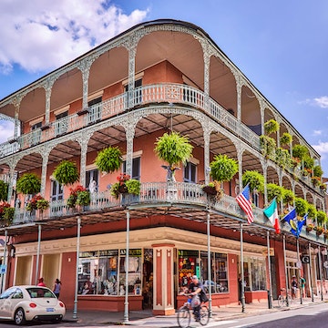 The wrought iron lace of a French Quarter Balcony in New Orleans.